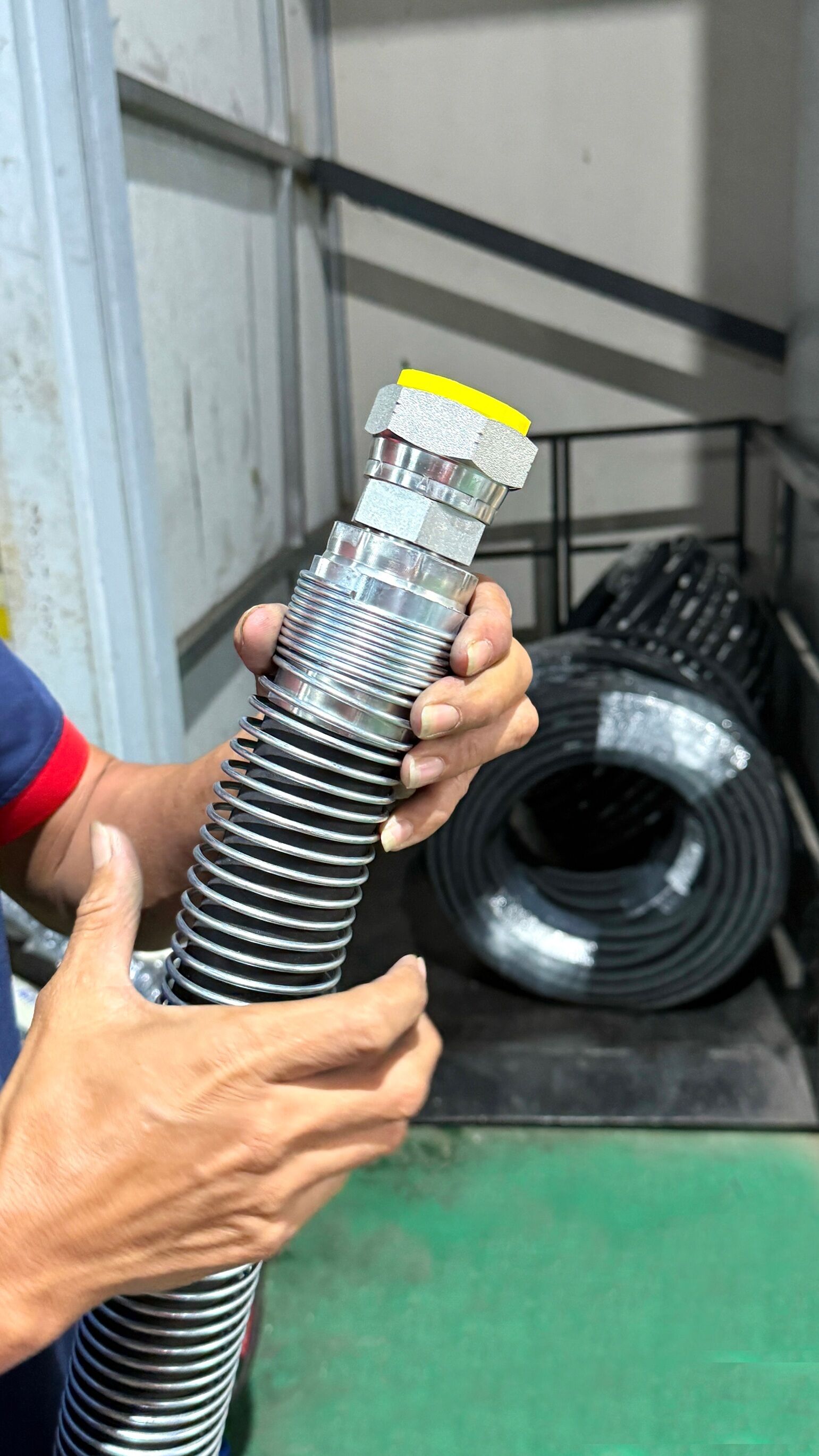 Crimping an additional ferrule collar to secure the steel spring
