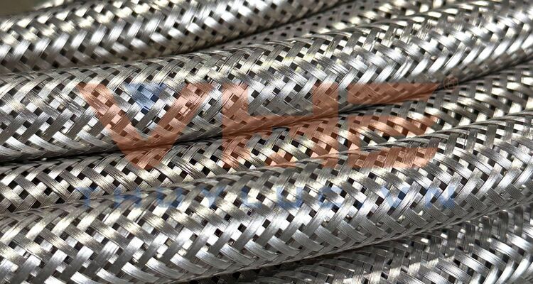 Custom stainless steel overbraiding services for hydraulic hoses at VHE workshop